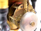 a close up of a clock that is on a table