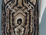 a black and gold beaded dress on a mannequin mannequin mannequin mannequin mannequin mannequin mannequin manne