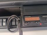 a car radio with a cord attached to it