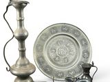 a silver plate and a silver vase and a silver plate and a silver plate and a silver plate and a silver plate and a silver plate and a silver