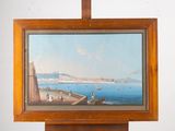 a picture of a painting hanging on a wooden easel