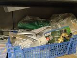 a blue basket filled with various items on a counter