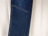 the back of a pair of jeans hanging on a hanger