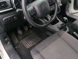 a car dashboard with a steering wheel and a dash board
