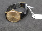 an image of a wrist watch with a tag on it