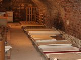 many beds that are lined up in a tunnel