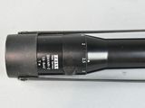 a close up of a flashlight on a white surface