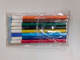 six markers in a plastic bag on a table