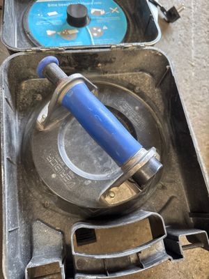 a tool in a case that is sitting on the floor