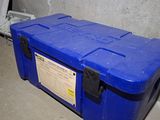 a blue box sitting on the floor in a room