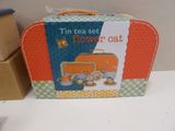 a small suitcase with a cat on it sitting on a table