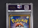 a close up of a pokemon card on a black surface