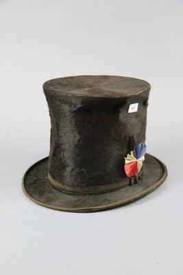 a black top hat with a red and blue flag on it