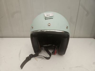 a helmet on a table with a tag on it