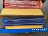 two boxes of expanded mesh are stacked on top of each other