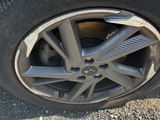 the tire of a car with a flat tire on the road