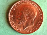 a penny on a table with a green background