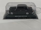 a black model car in a clear box on a white surface