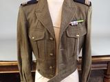 uniform jacket on a mannequin on a table in a room