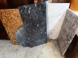 four different types of granite on display in a store