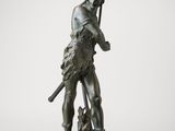 an old bronze statue of a man with a dog on a white background