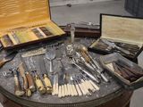 many different types of knives and knives on a table