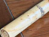 a baseball bat laying on the floor on the floor