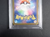 a close up of a pokemon card in a clear plastic case