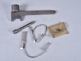 a hammer, chain, and other tools on a white surface