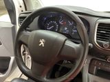 dashboard of a car with a steering wheel and dashboard controls