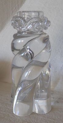 a clear glass vase with a spiral design on it