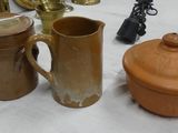 many different types of pottery on the table
