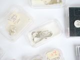 many different types of sewing needles in plastic containers