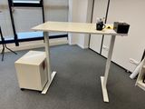 an image of a desk in an office with a coffee cup on it