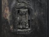 an image of a metal plaque with a cat on it