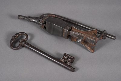 two old keys sitting next to each other on a table