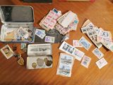a suitcase full of stamps and money sitting on a table