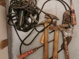 many tools that are laying on the floor next to each other