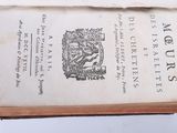an old book with a picture of a man on it