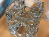 a glass vase that is sitting on a table