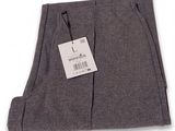 men ' s grey wool trousers with a tag on a white background