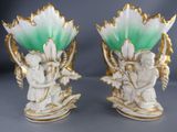 pair of white and green vases with angels on them