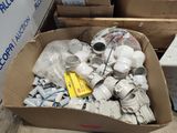 a cardboard box filled with assorted items on the floor