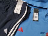 a cell phone sitting on top of a pair of shorts