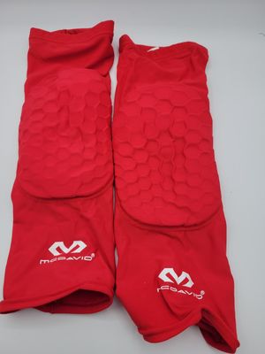 a pair of red knee pads with white logos on them