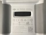 a close up of a white electronic device on a table