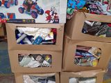 boxes of toys are stacked on top of each other on a pallet