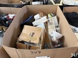 a cardboard box full of items that are in a room