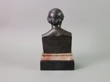 a statue of a bust of a man on a marble base