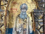 an old painting of a man with a beard in a gold frame